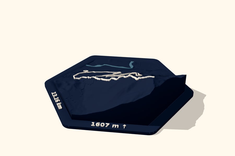 Digital design preview of a Mailbox Peak trail relief: dark Ink hexagon terrain with a raised ivory route and printed distance and elevation gain.