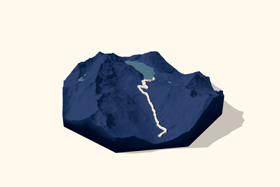Digital design preview of a Snow Lake trail relief: navy octagonal mountain terrain with a steel-blue lake and a raised ivory trail.